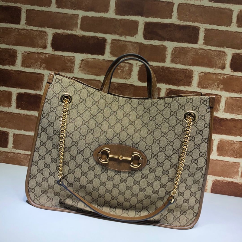 G*u*i shopping bags